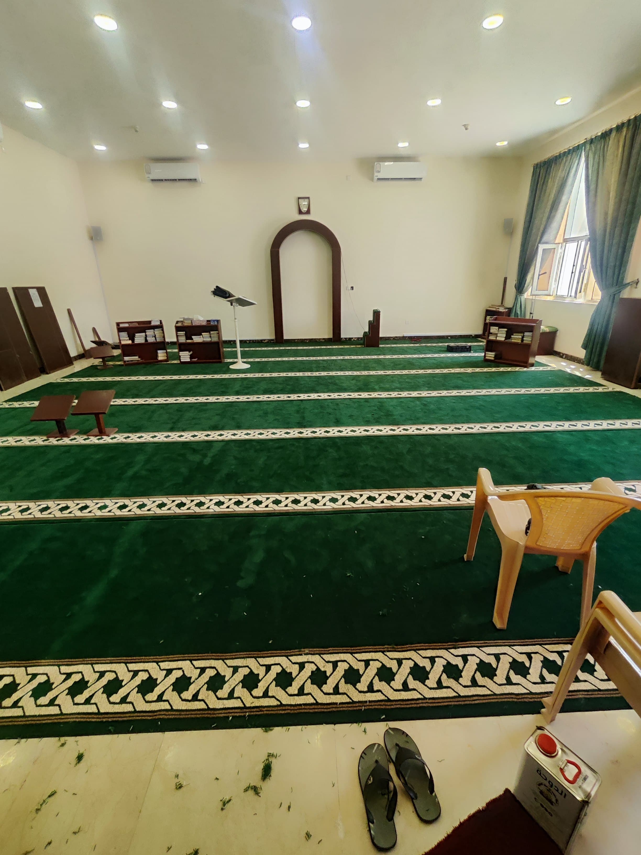 Mosque carpet installation with prayer rows being set to the qiblah in Qatar (view 3)